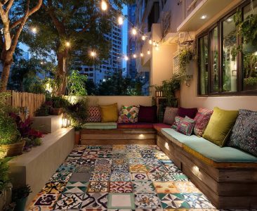 Bohemian Balcony Design With Patterned Tiles and Built-in Seating-img