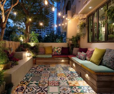 Bohemian Balcony Design With Patterned Tiles and Built-in Seating-img
