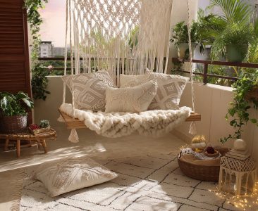 Bohemian Balcony Design with Swing and Patterned Pillows-img