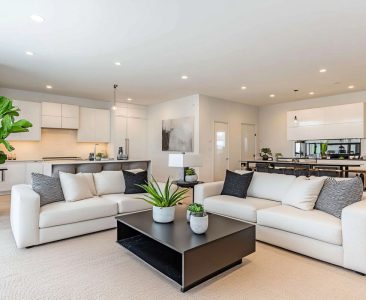 Contemporary Living Room Design with White Sofas and Black Coffee Table-img