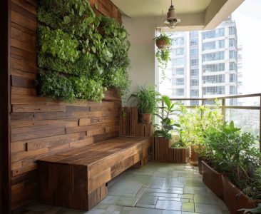 tropical-balcony-design-with-vertical-garden-and-floating-wooden-bench-img
